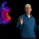 Apple CEO Tim Cook onstage with Apple logo in background